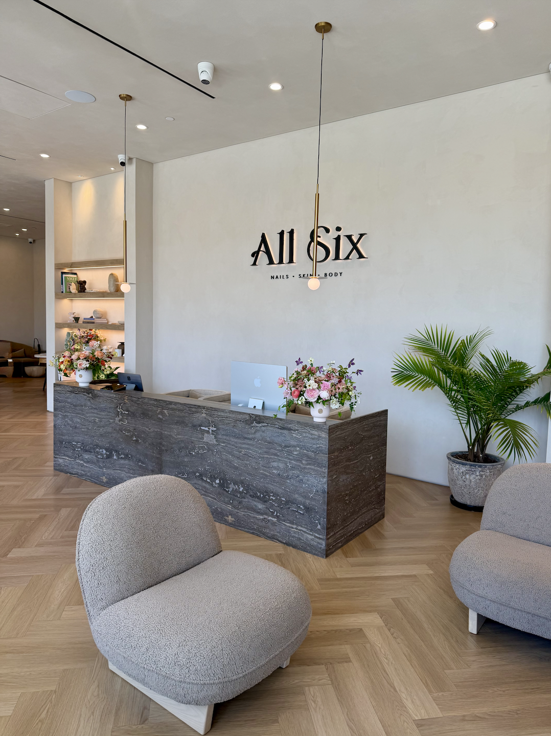 All Six salon reception and wall logo